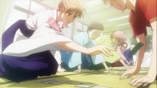 Chihaya lunges for a card